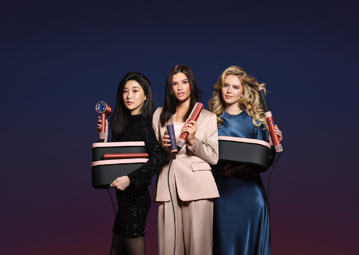 Dyson introduces special edition hair care devices in Strawberry bronze and blush pink for the holiday season, with exclusive accessories